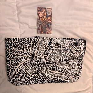 Hand painted one of a kind black and white clutch purse.